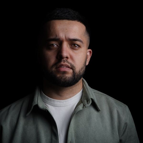 A silhouette of a person in a balanced pose against a calm, dark background.